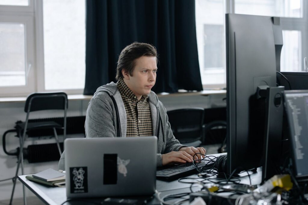 Photo of a Man Programming